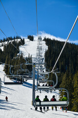 Ski chair lift at Breckenridge ski resort in winter time with snow in the Colorado Rocky Mountains - obrazy, fototapety, plakaty