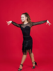 happy teen girl ballroom dancer. childhood happiness. dancing school. child dancing in black dress....