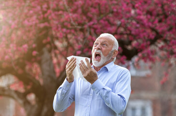 Old man  having spring allergy reaction