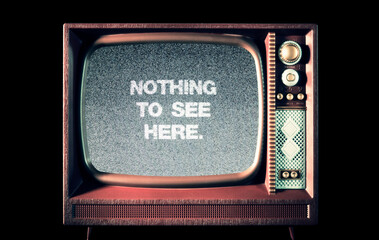 The text message Nothing to see here, over static noise from an old retro TV set (vintage toy television).

