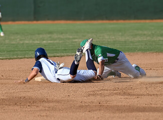 Action photo of high school baseball players making amazing plays during a baseball game