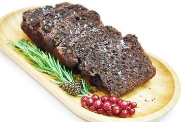 Chunks of cereal bread with currants and rosemary on plate