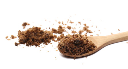 Sugar muscovado in wooden spoon isolated on white background