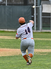 Obraz premium Action photo of high school baseball players making amazing plays during a baseball game