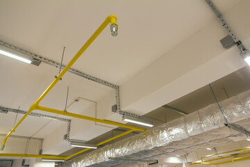 The fire suppression system in the building. Pipe with sprinkler