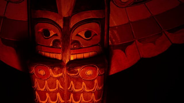 Totem Pole In Fire Glow Outdoors