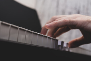 a man playing a keyboard instrument