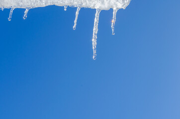 Obraz na płótnie Canvas Spring thaw, the icicle is melting.