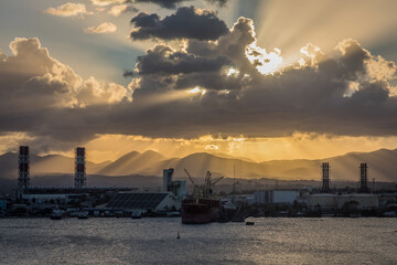 Sun setting over shipping port in Caribbean Island