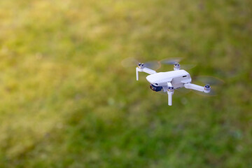 A drone flying outdoor, zoom photo, technology theme