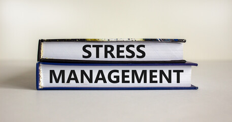 Stress management symbol. Books with words 'Stress management'. Beautiful white background. Psychological, business and stress management concept. Copy space.