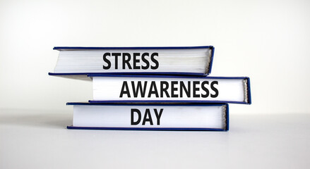 Stress awareness day symbol. Books with words 'Stress awareness day'. Beautiful white background. Psychological, business and stress awareness day concept. Copy space.