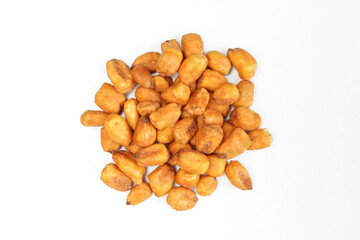 Pile of roasted corn seeds isolated on white background. Crunchy and salty snack