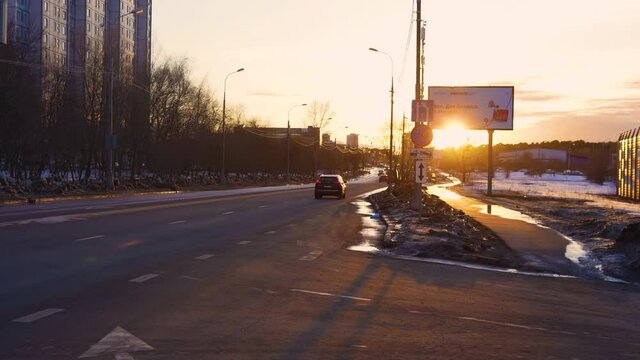 in the golden hour ars drive on the highway, spring sunset in the golden hour