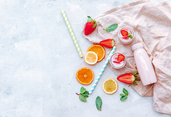 Tasty strawberry milk shake on white background. Strawberry smoothies. Strawberry yogurt with fresh berries