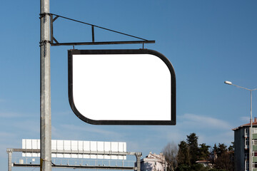 Blank metallic advertising board on the blue sky.