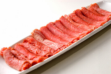 Filet mignon on a white plate to be served with the founde