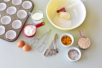 Baking ingredients and kitchen utensils for making healthy gourmet muffins and baked goods. Photo concept, food background, copy space, flay lay, close-up