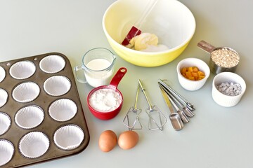 Fototapeta na wymiar Baking ingredients and kitchen utensils for making healthy gourmet muffins and baked goods. Photo concept, food background, copy space, flay lay, close-up