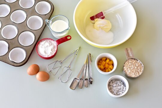 Baking ingredients and kitchen utensils for making healthy gourmet muffins and baked goods. Photo concept, food background, copy space, flay lay, close-up