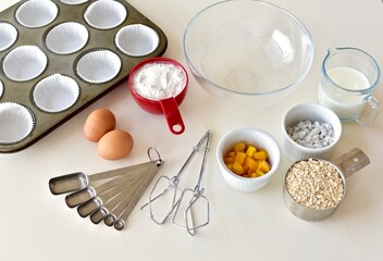 Baking ingredients and kitchen utensils for making healthy gourmet muffins and baked goods. Photo concept, food background, copy space, flay lay, close-up