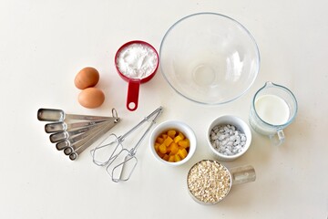 Baking ingredients and kitchen utensils for making healthy gourmet muffins and baked goods. Photo concept, food background, copy space, flay lay, close-up