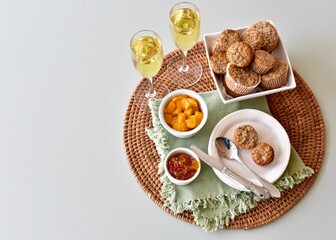 Simple breakfast brunch pastry muffins and champagne for  Mother's Day morning in bed or romantic holiday weekend. Photo concept food background, close-up, copy space