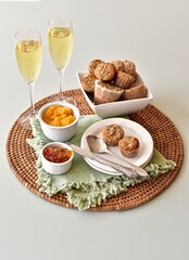 Simple breakfast brunch pastry muffins and champagne for  Mother's Day morning in bed or romantic holiday weekend. Photo concept food background, close-up, copy space