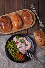 Homemade breakfast. Baked pork, vegetables, homemade baked pies