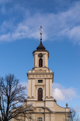 Fototapeta na wymiar Church tower and City Hall in Swiebodzice