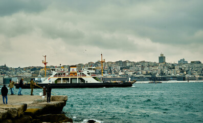 Turkey istanbul 04.03.2021. Famous galata tower of istanbul taken photo from istanbul bosporus. it is established by genoese sailors for watching of bosporus of constantinople.