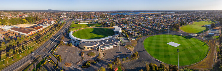 Aerial view of a AFL football stadium with surrounding vacant car park