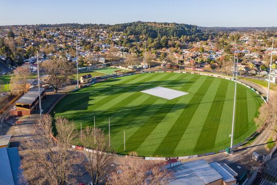 Aerial view of an AFL football oval amongst suburban housing