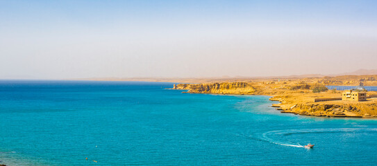 beautiful panoramic views of Sharm El Maya Bay, Hadaba in Sharm El Sheikh, Egypt, South Sinai, with clear blue sea and sun-drenched cliffs