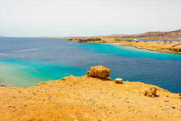 beautiful panoramic views of Sharm El Maya Bay, Hadaba in Sharm El Sheikh, Egypt, South Sinai, with clear blue sea and sun-drenched cliffs
