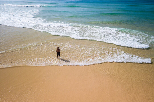 aerial view of man fishing in ocean