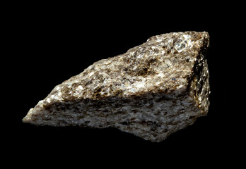 A shiny muscovite mica mineral blotch in rock isolated on black background. For geology mineralogy...