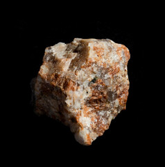 Red pink granite mineral rock isolated on black background. For geology or mineralogy websites, stone collection catalog, Natural Science museum wall charts or posters