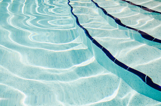 Stairs at edge of swimming pool