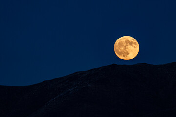 USA, Idaho, Bellevue, Full moon rising over hills