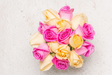 Bouquet of fresh multicolored roses in a vase