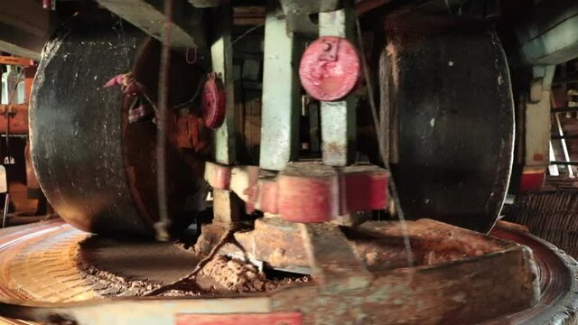 A typical dutch windmill. Mechanism of old wooden water mill with large wooden wheels. Age-Old Industrial Process. Zaandam Zaanse Schans near Amsterdan. Holland, artisanal production. 
