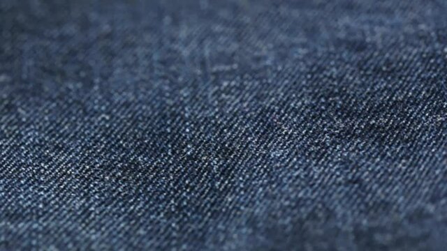 Close up from rotating blue denim material