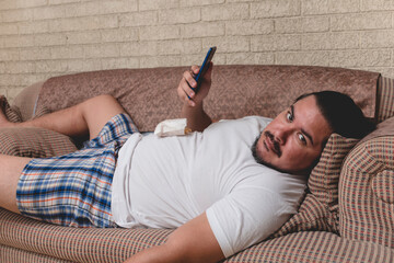 An unproductive and very lazy man with french fries on his stomach and on the phone all day....