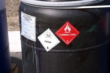 black plastic drum with hazardous waste.