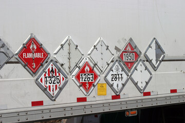 various hazard plackards on the side of a truck © mike ledray
