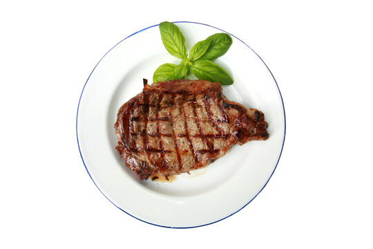 Hot Fresh Grilled Boneless Rib Eye Steak Isolated On White With Barbecue Grill Marks In The Meat