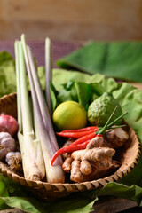 Thai food ingredients, Spices and herbs for cooking in a bamboo basket, Organic vegetables