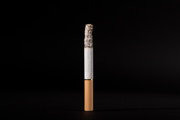 Cigarette smoking closeup isolated on balck background