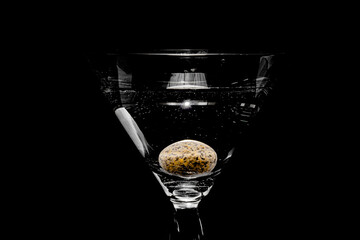 glass with martini and candy
